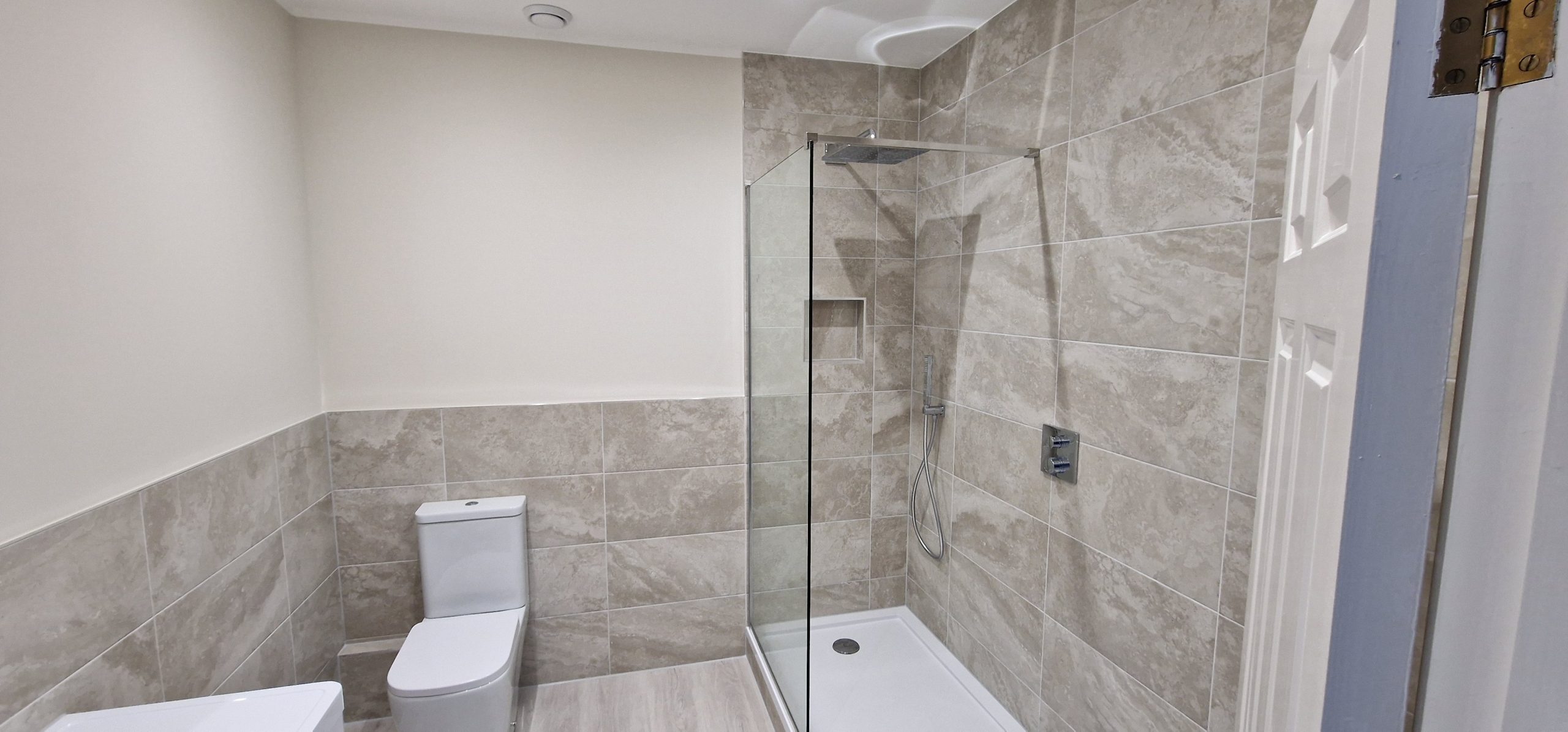 Bathroom repair and walk-in shower installation completed in South London.