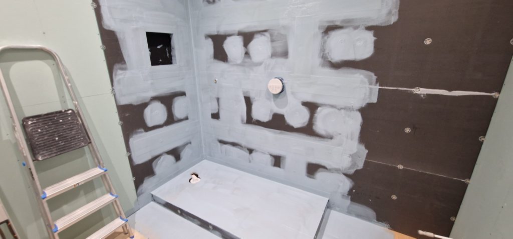 Bathroom refurbishment project showing shower area waterproofing and preparation before tiling in London