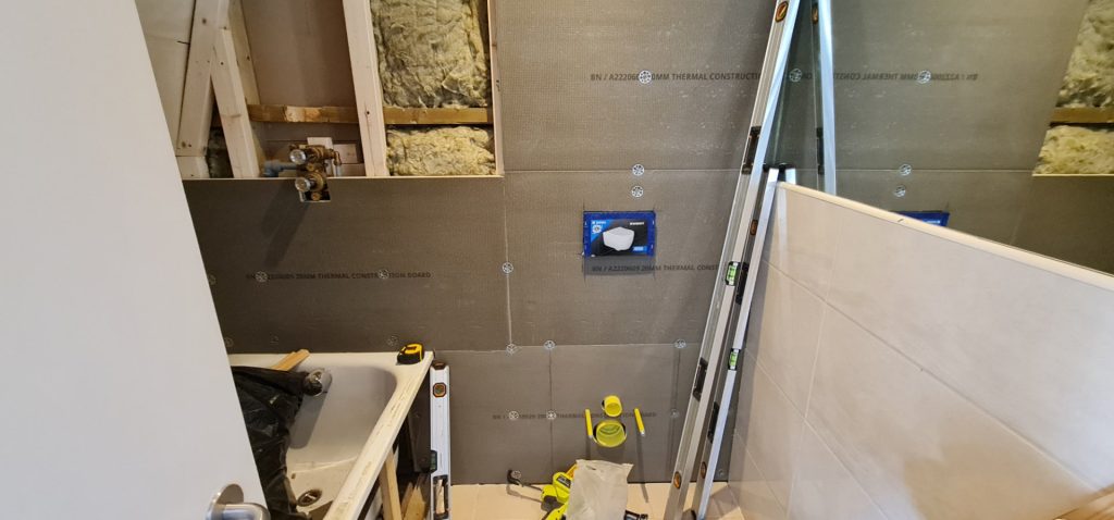 Shower leak repair showing bathroom walls opened and waterproof boards installed during repair in London
