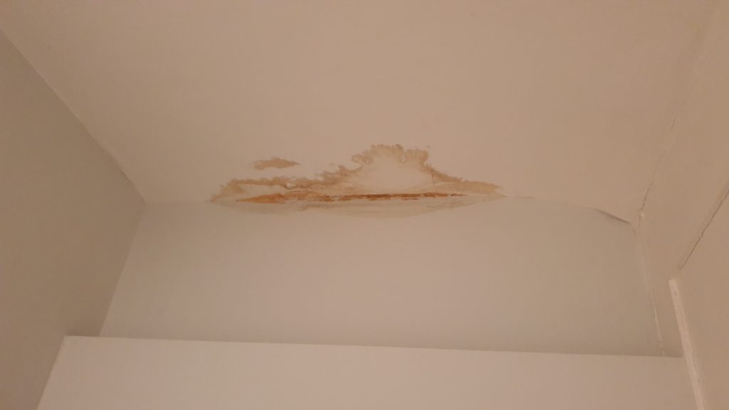 Ceiling water damage caused by leaking shower above during shower leak investigation in London
